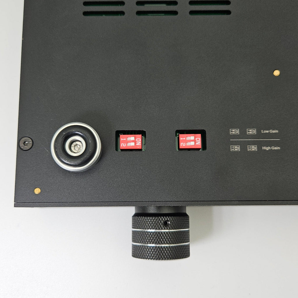Black electronic device with control buttons on a white background