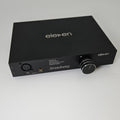 Black electronic device with 'eleven' branding on a white background