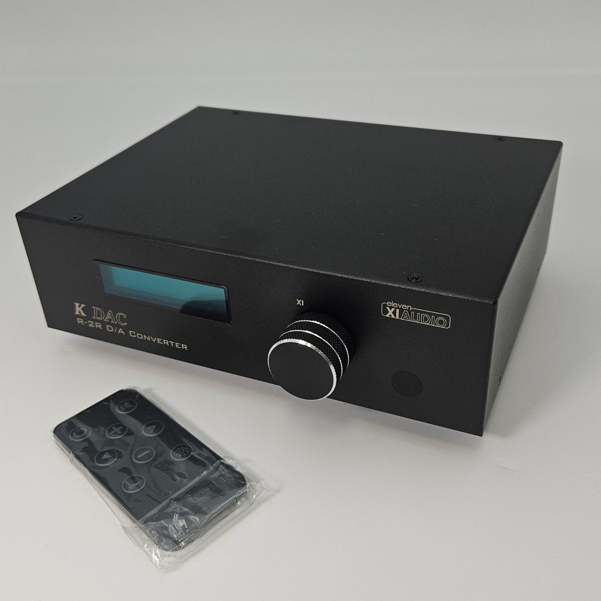 Black electronic device with a clear plastic cover on a white background